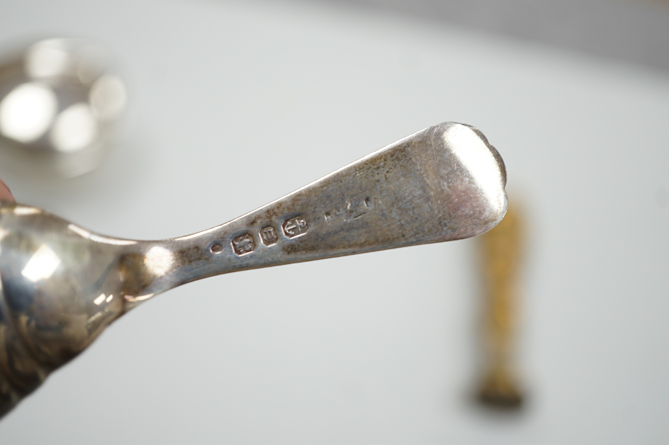 A late Victorian silver caddy spoon, 92mm, a silver cigarette holder, toothbrush, two trinket boxes and a brass seal.